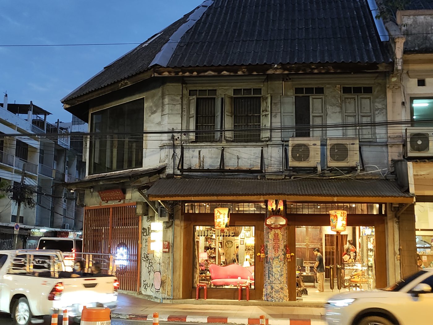 Charoen Krung — Siam's first paved road, cut 1862–64 because the foreign consuls petitioned that they had nowhere to ride. The masonry rows followed it.